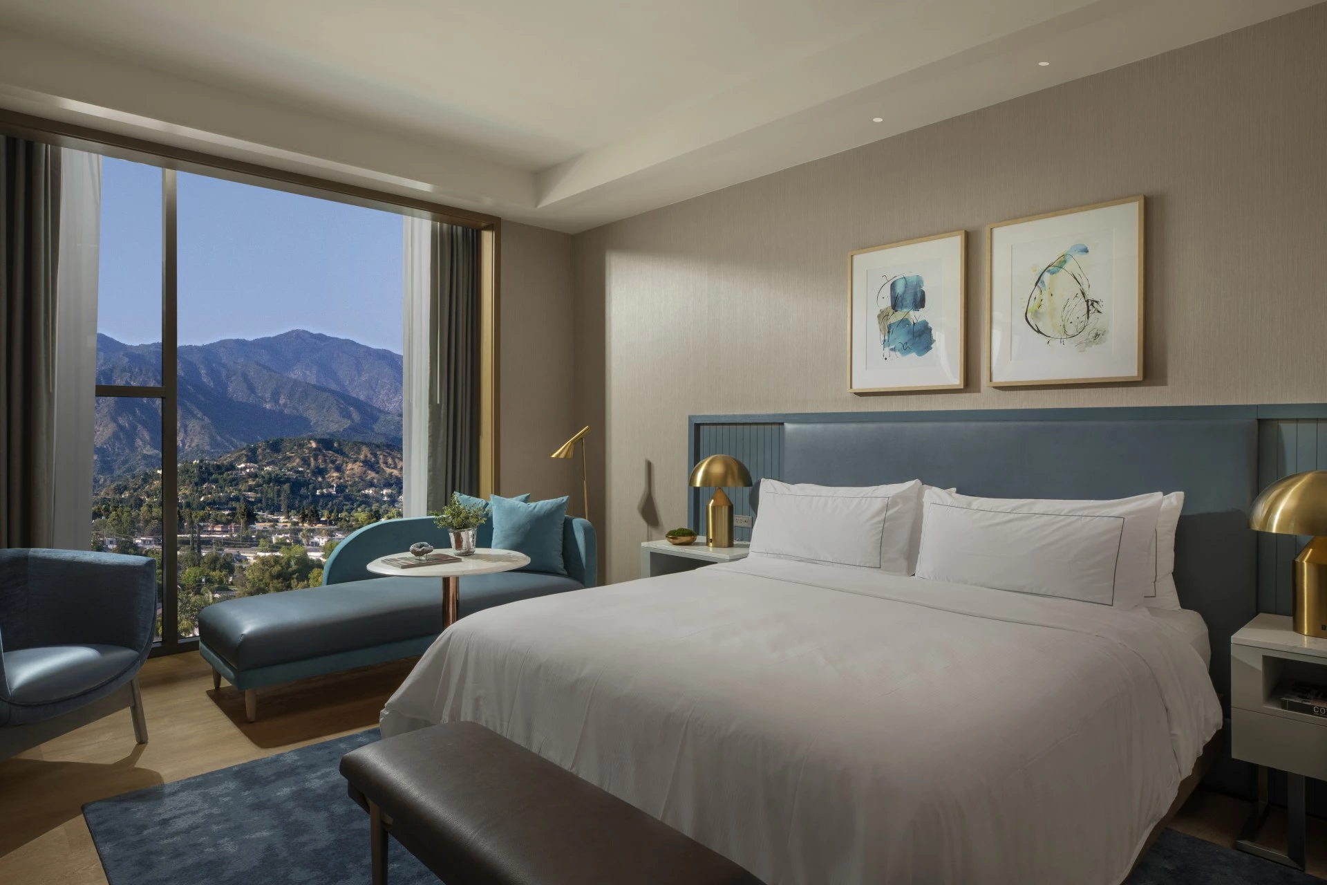 a bedroom with a bed and a table and chairs