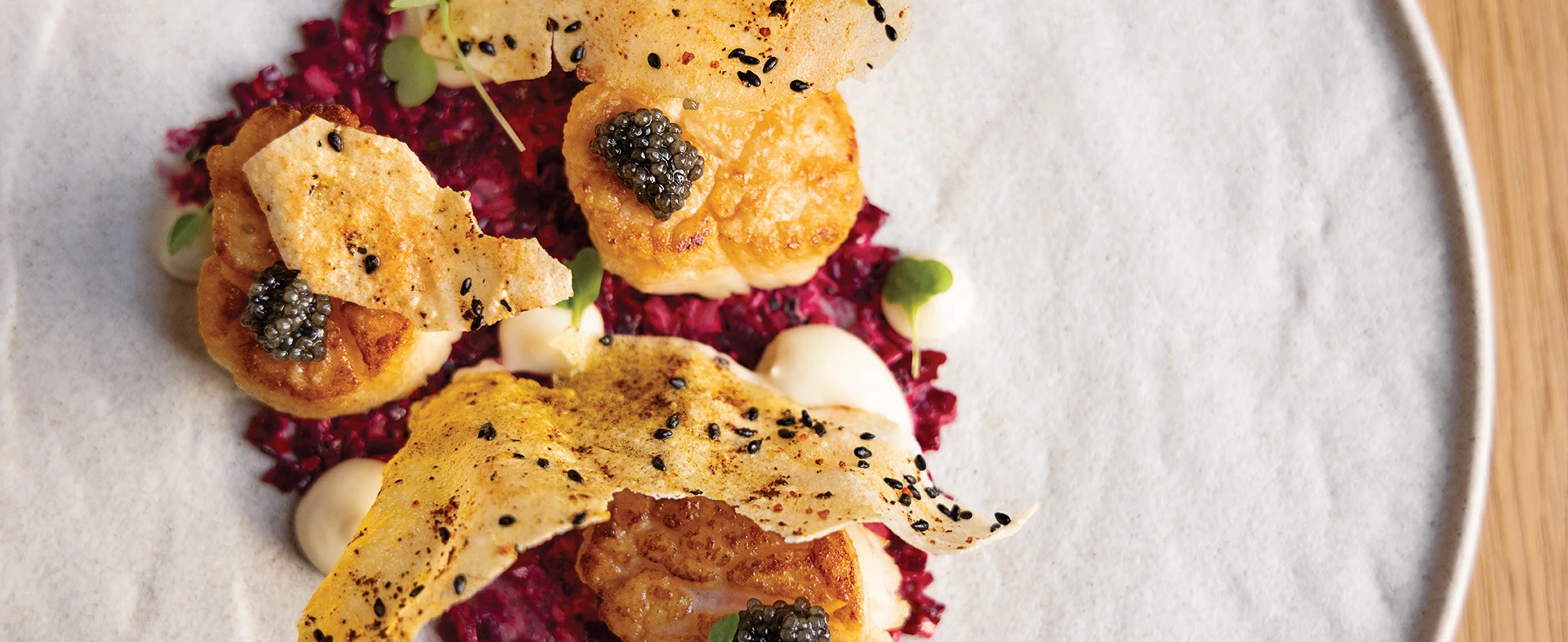 aerial view of a plate of seared scallops