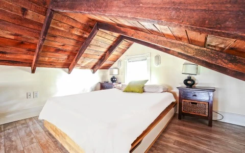 bedroom with an angled ceiling 