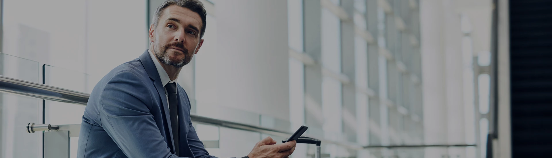 well dressed guy sitting looking to the left side