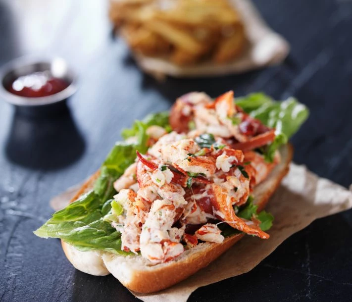 a lobster sandwich on a piece of bread