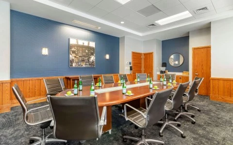 a conference room with a table and chairs