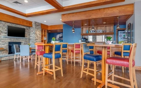 a room with a bar and chairs