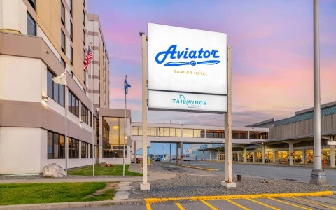 a sign in front of a hotel