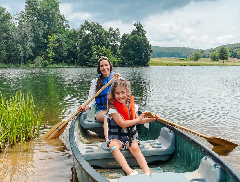 a group of people in a canoe on a river