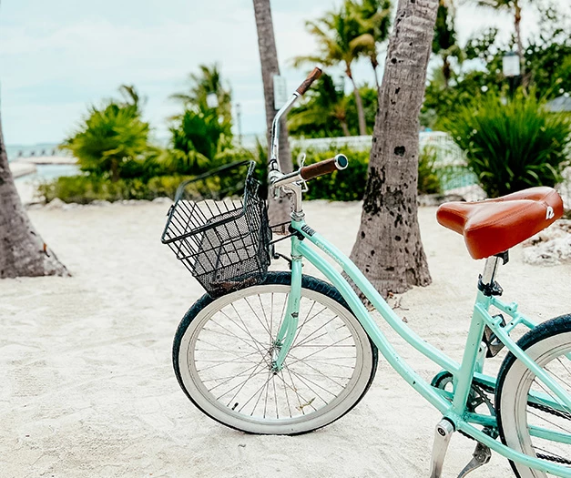 a bicycle parked on a beach