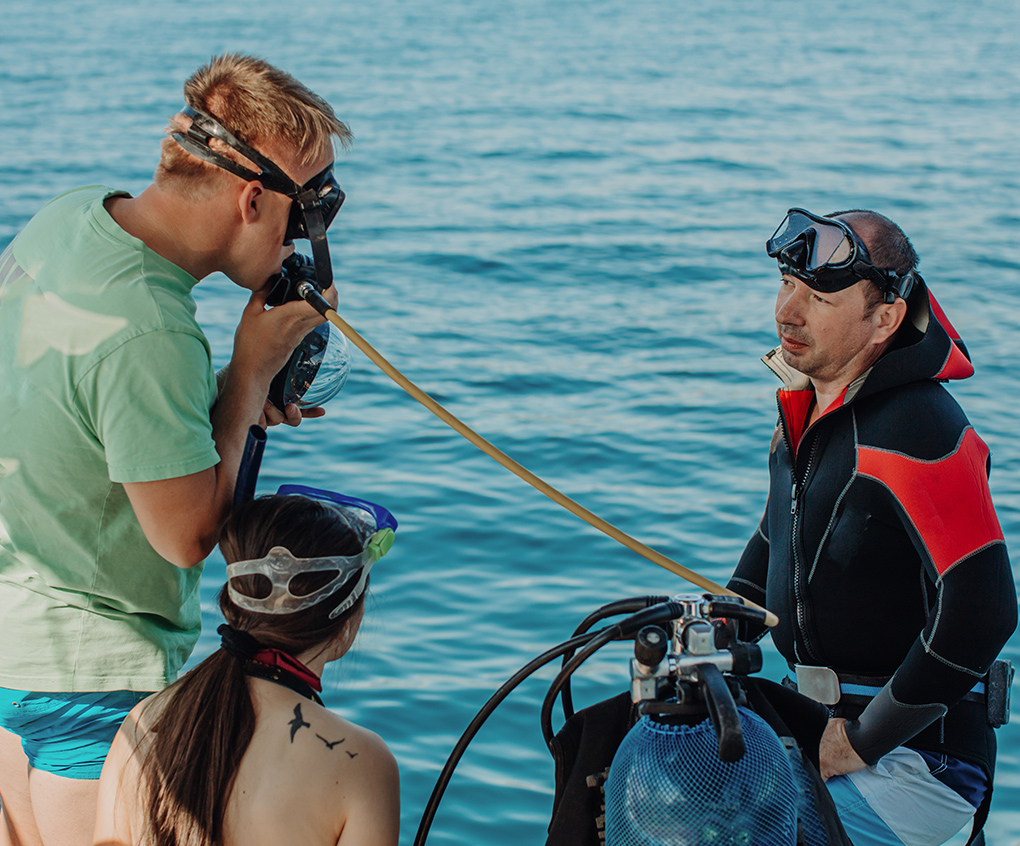 a group of people in diving gear