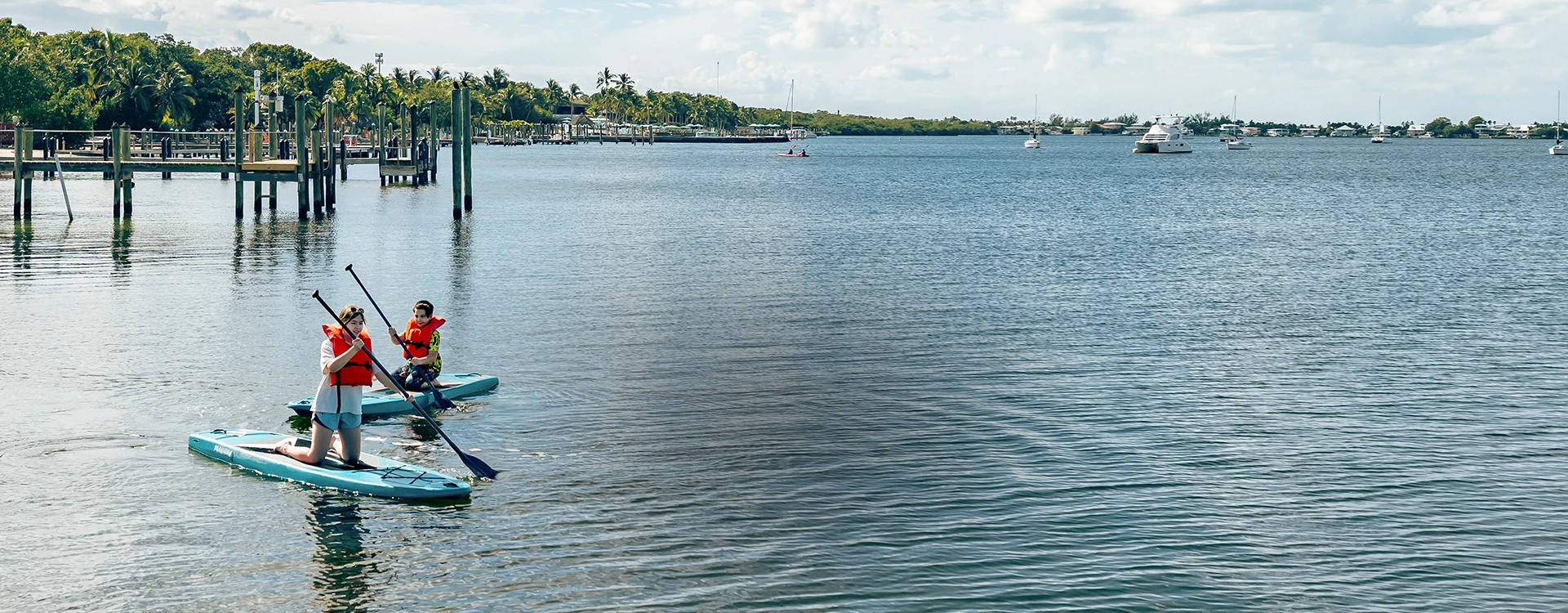 a person in a blue kayak in a body of water