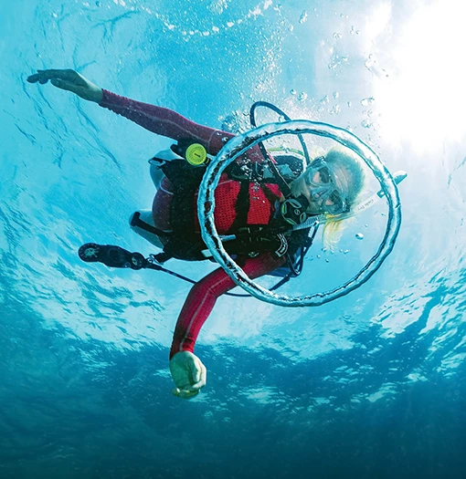a woman underwater with a scuba gear