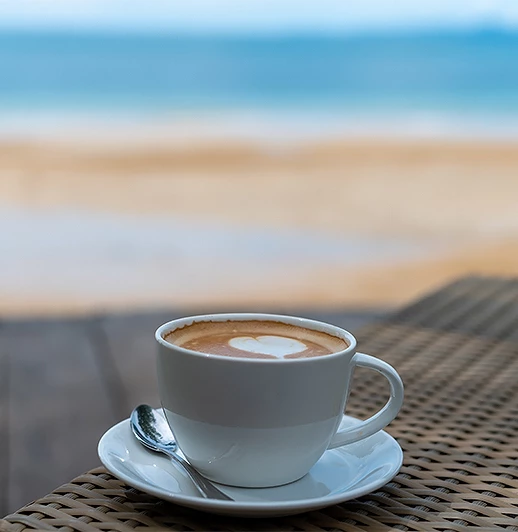 a cup of coffee with a heart on top of it
