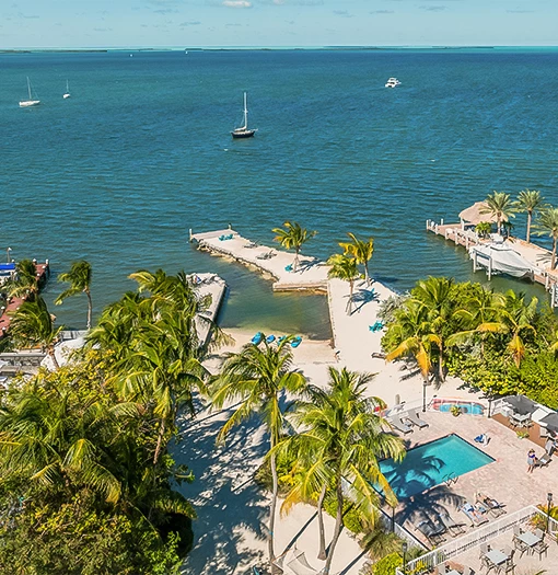 a body of water with a dock and a pool