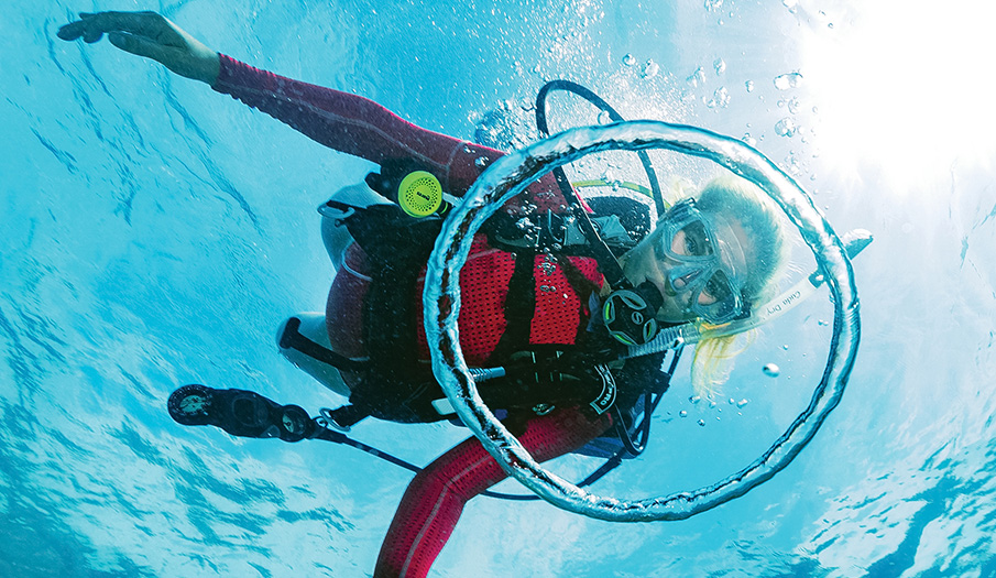 a woman scuba diving underwater