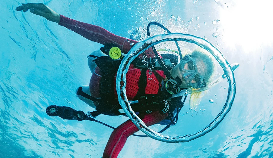 a woman scuba diving underwater