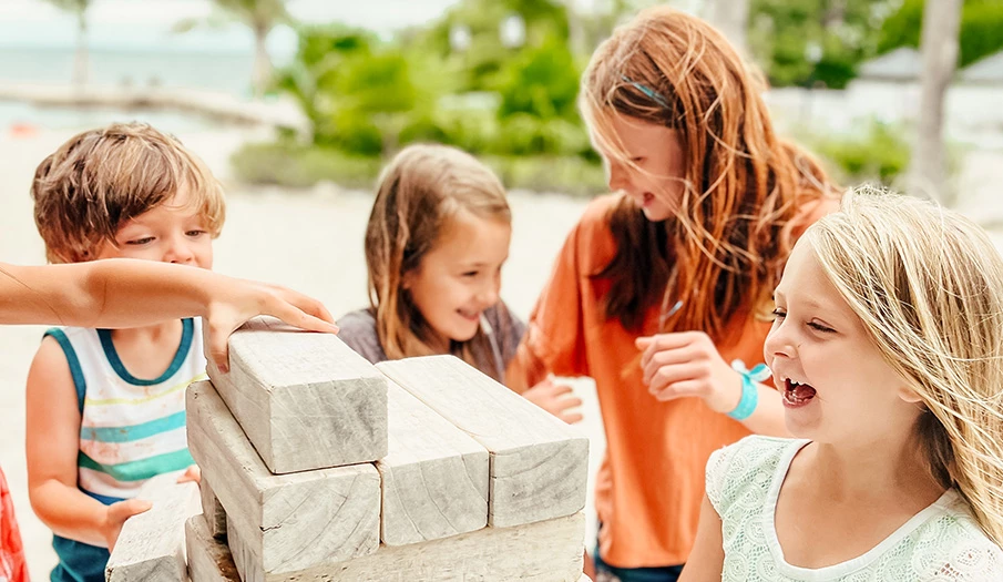 a group of kids playing with blocks