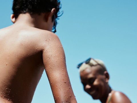 a person with water droplets on their arm
