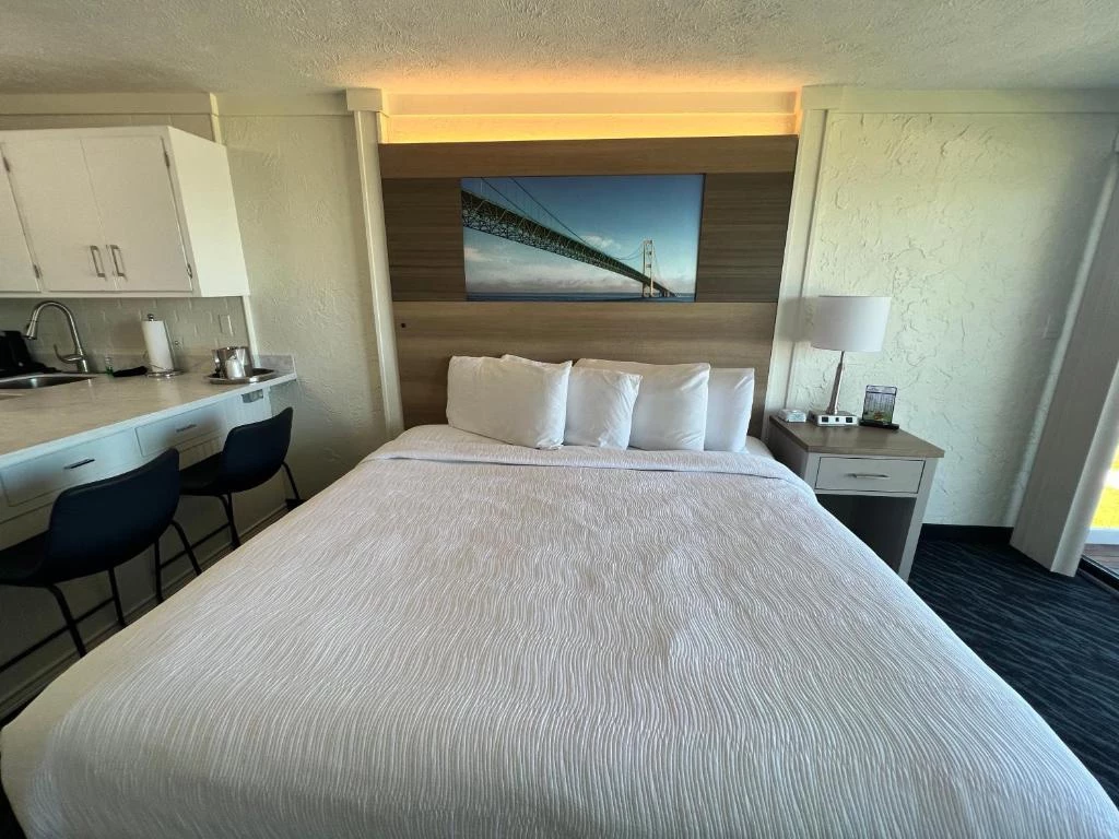 a bed with a picture of a bridge
