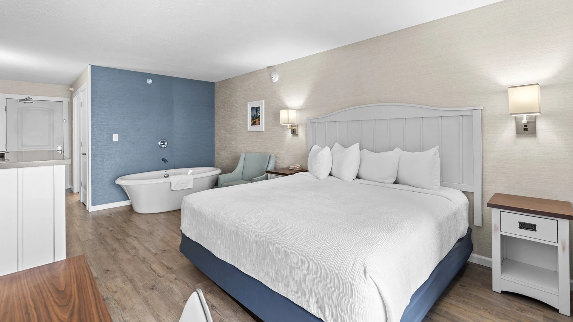 a room with a bed and bathtub
