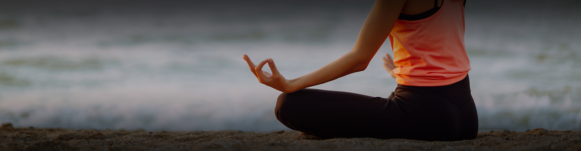 a person sitting in the sand