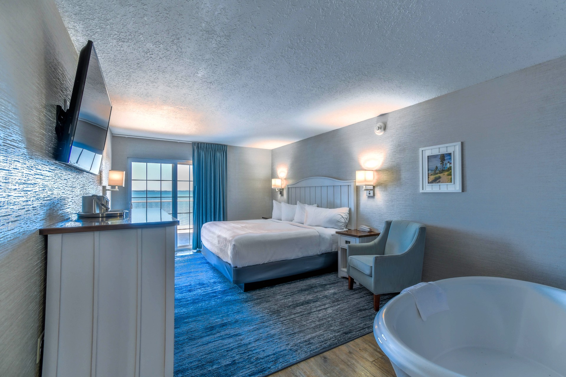 a room with a bed and a tub