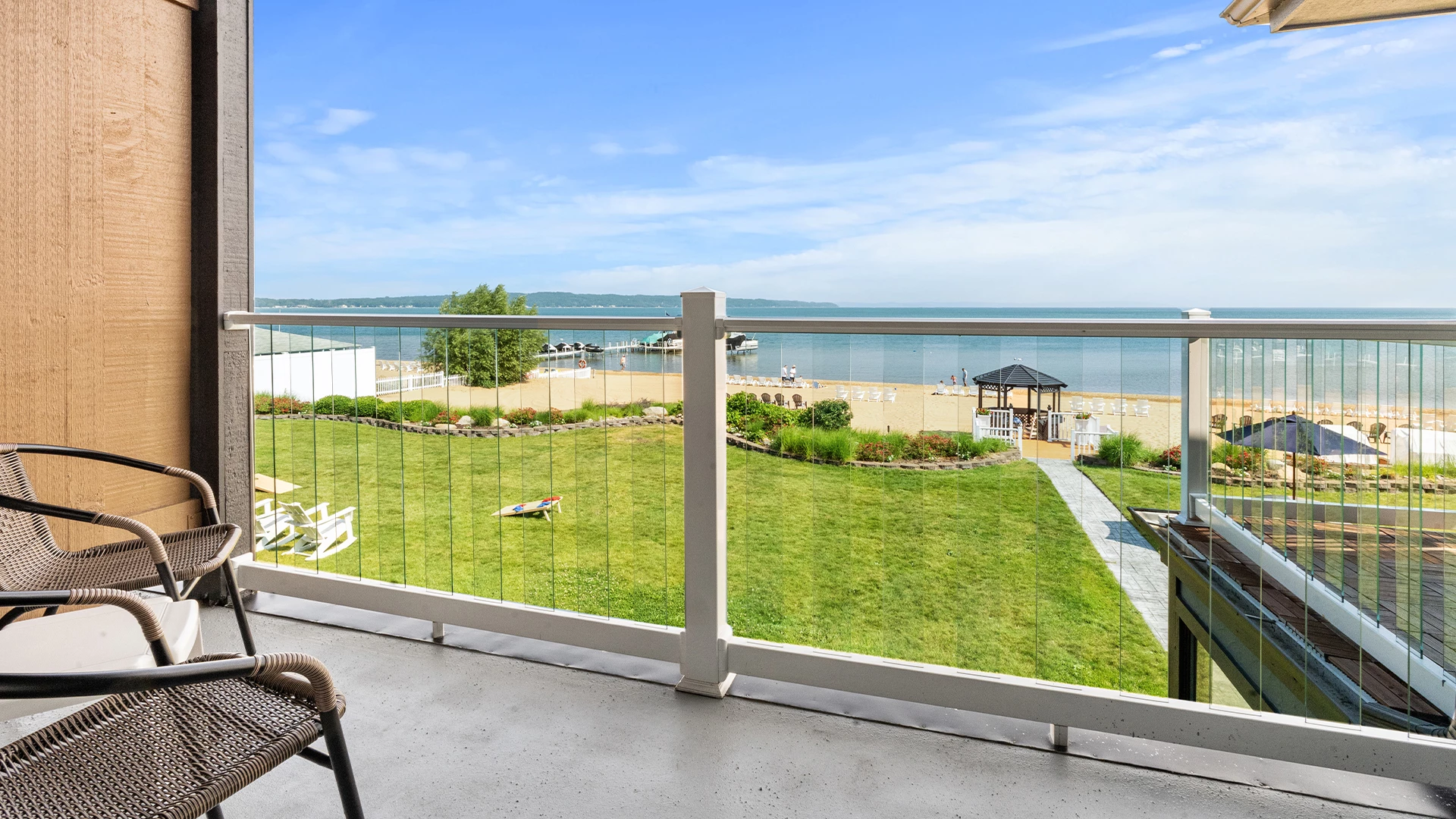 a deck overlooking a beach and a body of water