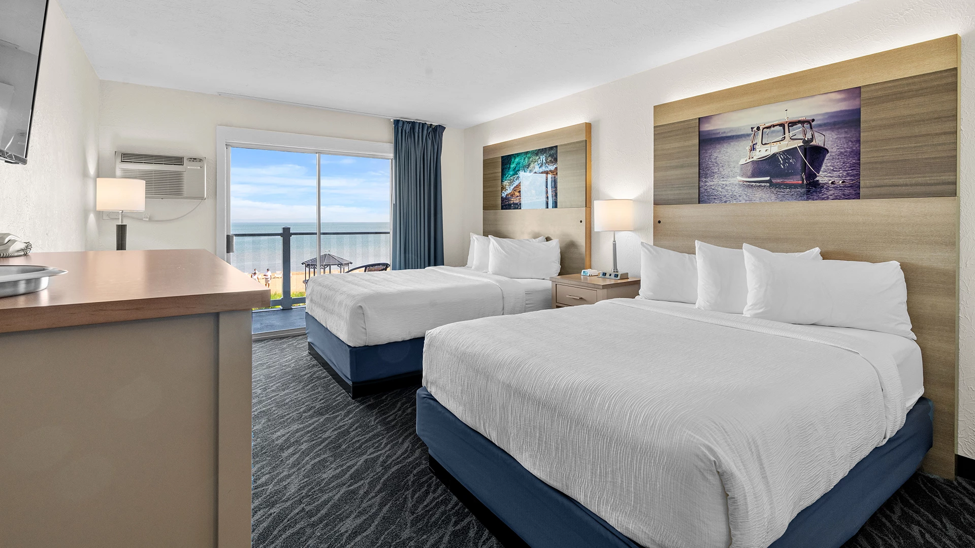 a room with two beds and a window