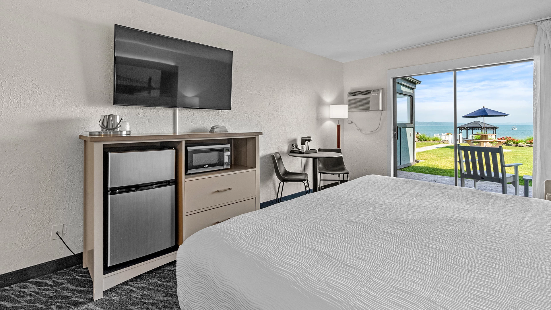a room with a bed and a television