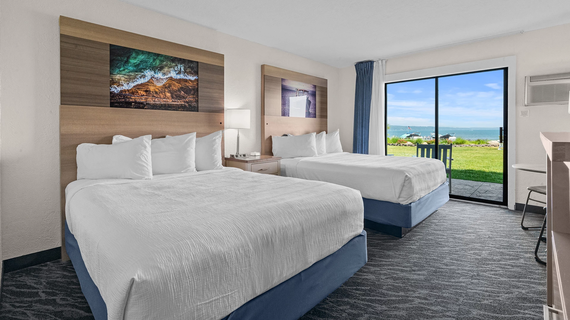 a room with two beds and a window