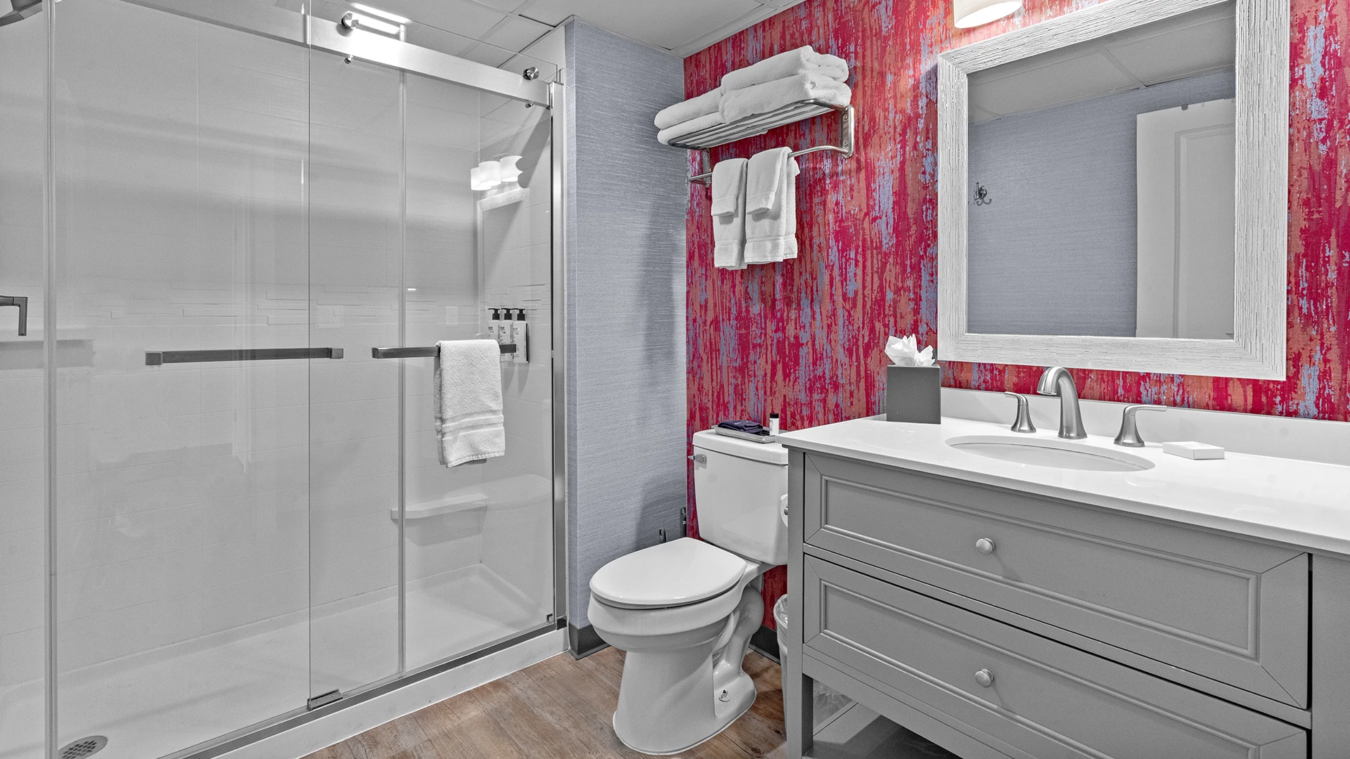 a bathroom with a shower and toilet