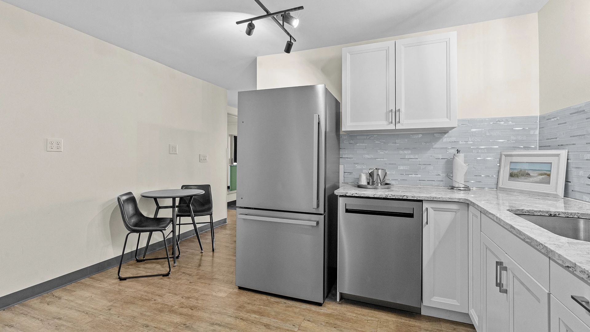 a kitchen with a table and chairs