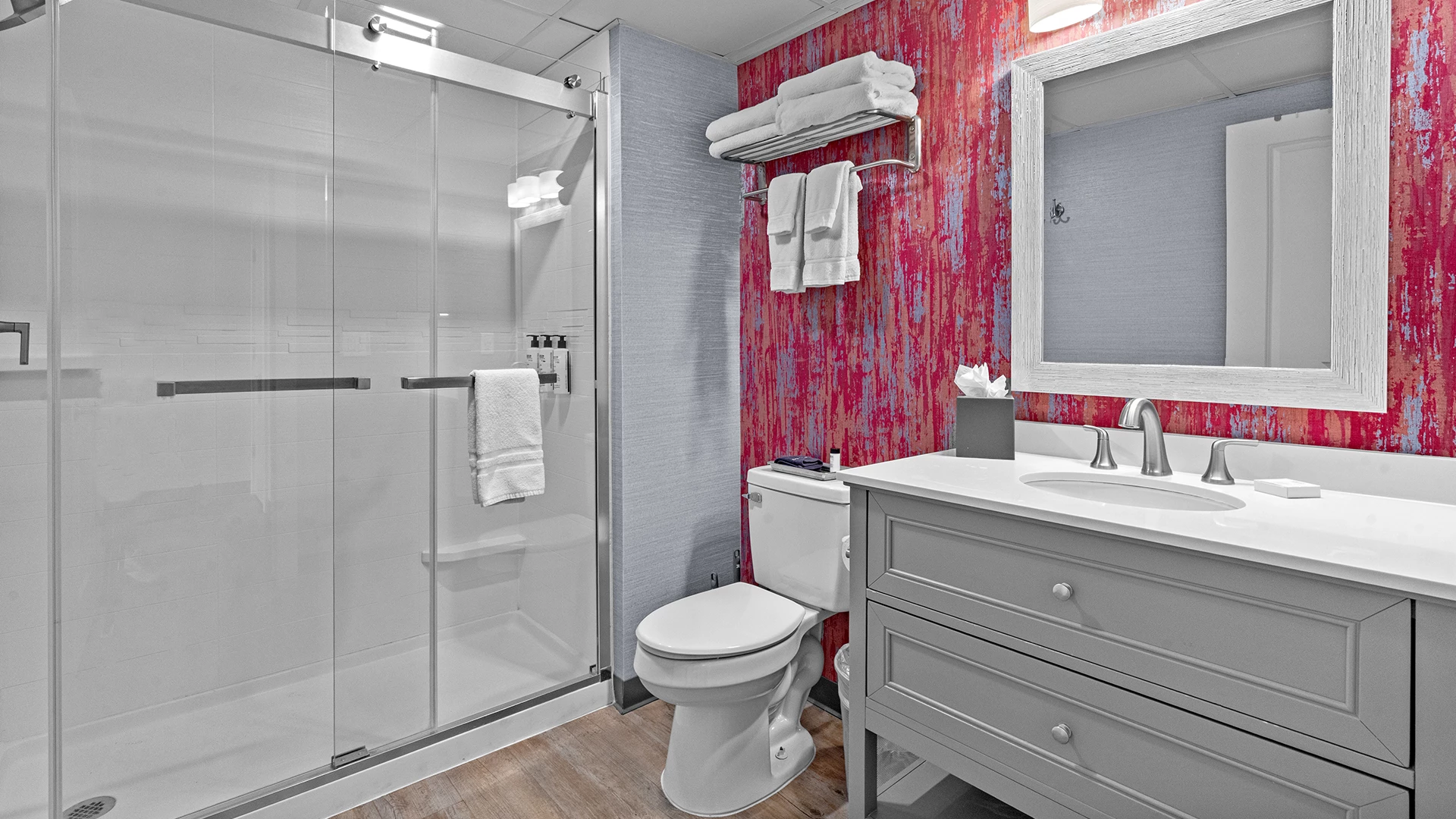 a bathroom with a shower and toilet