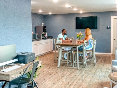 a man and woman sitting at a table