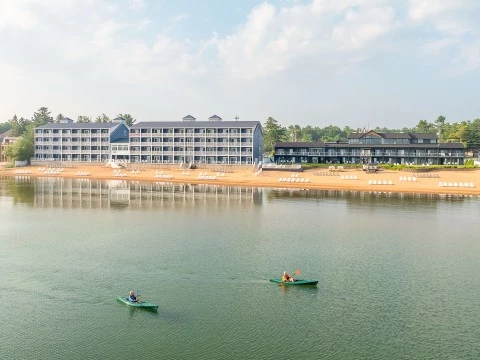 a couple of people in canoes on a lake