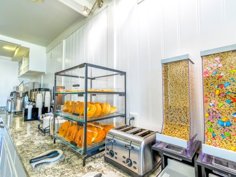 a display case with bread and cereals