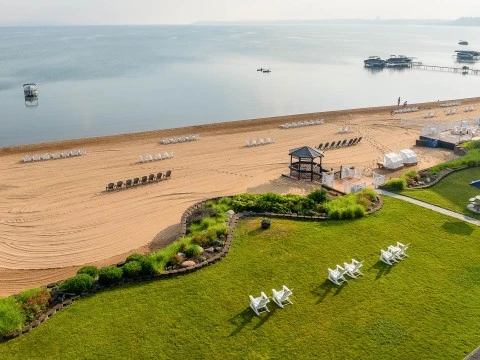 a beach with chairs and a gazebo