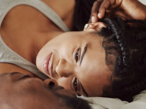 a woman lying on a bed