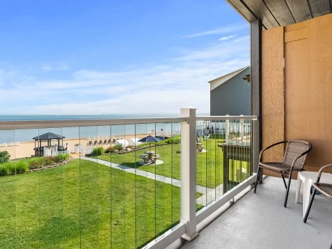 a balcony with a lawn and a chair