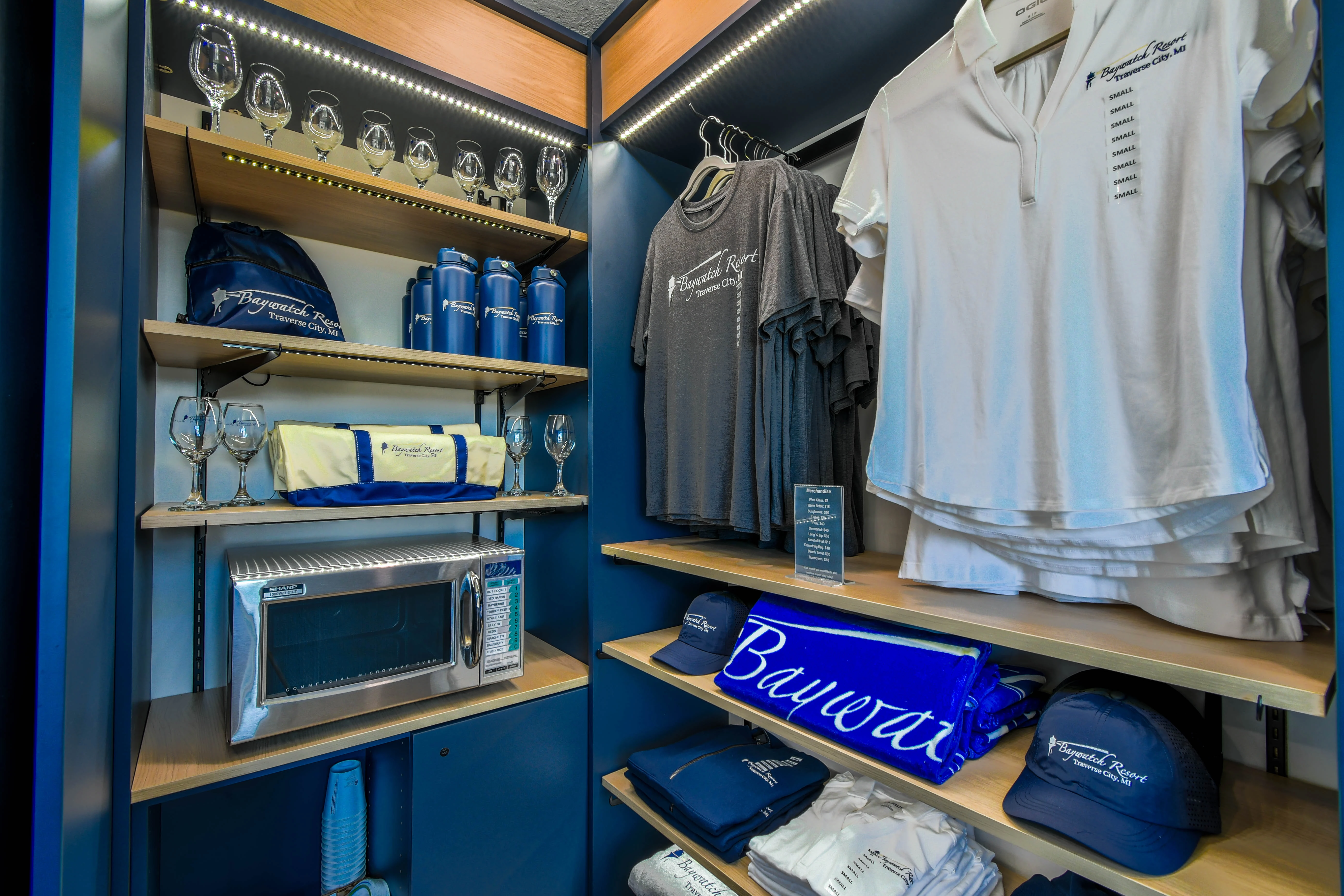 a display of clothing and drinks on shelves
