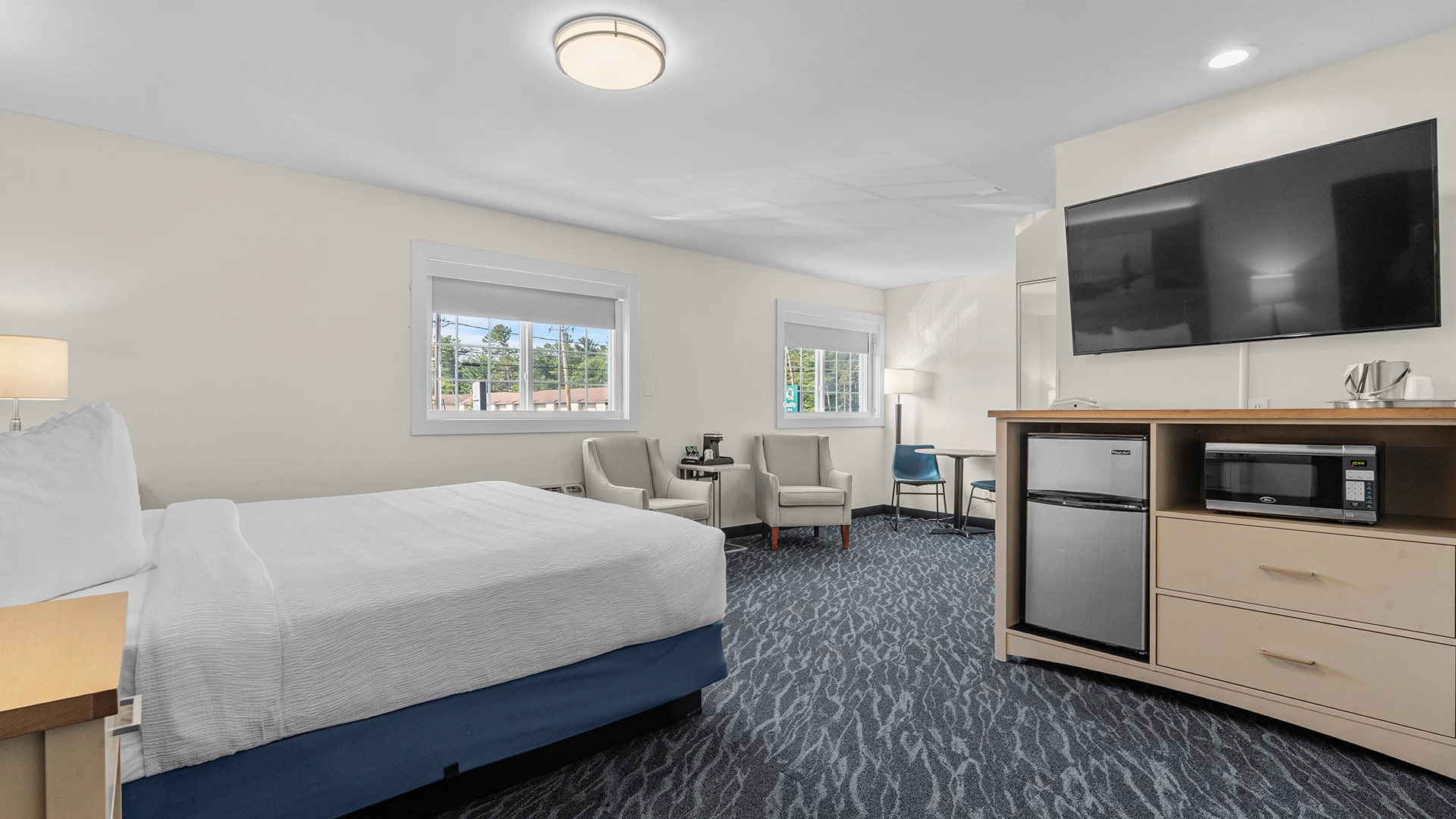 a room with a bed and a television