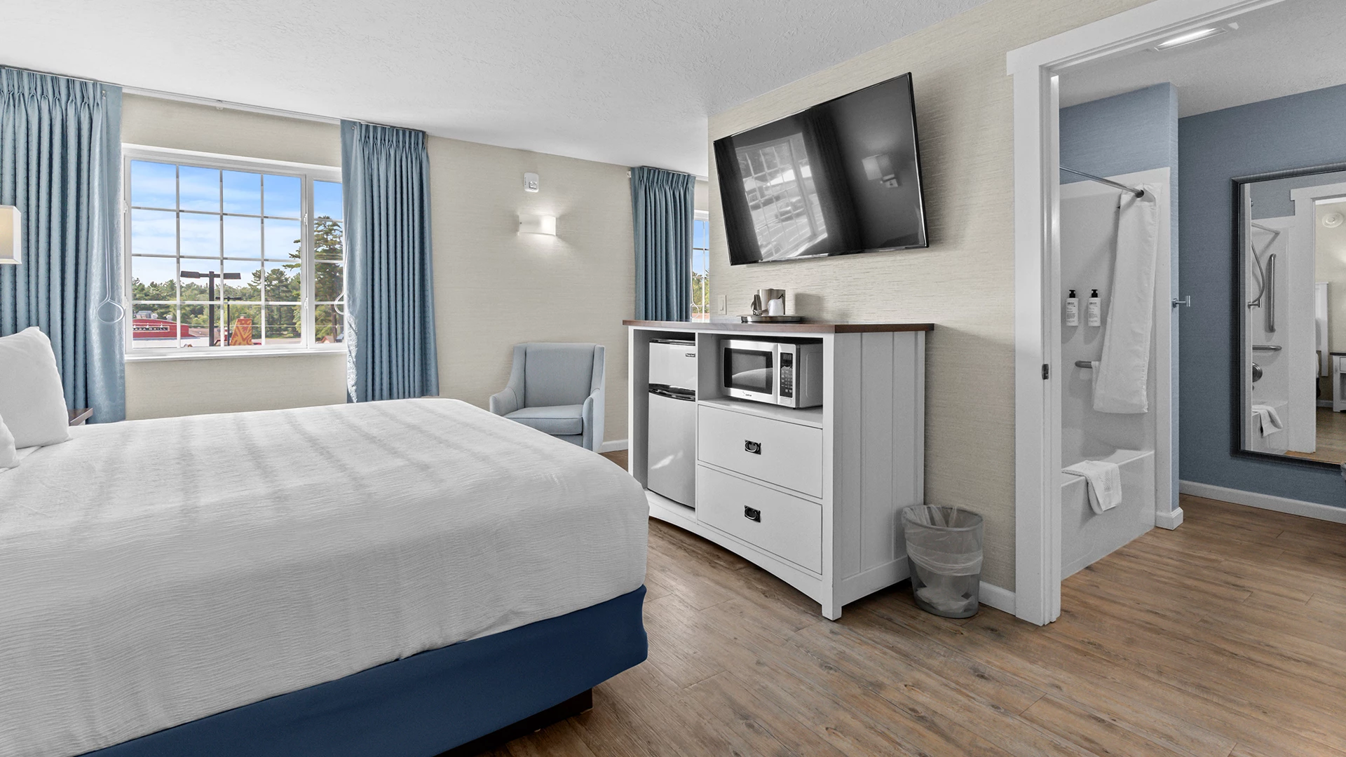 a room with a bed and a television on the wall