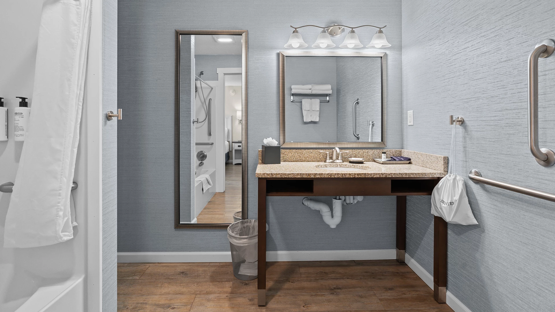 a bathroom with a mirror and sink
