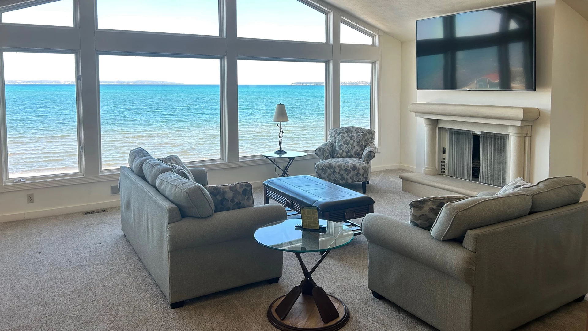a living room with a fireplace and couches