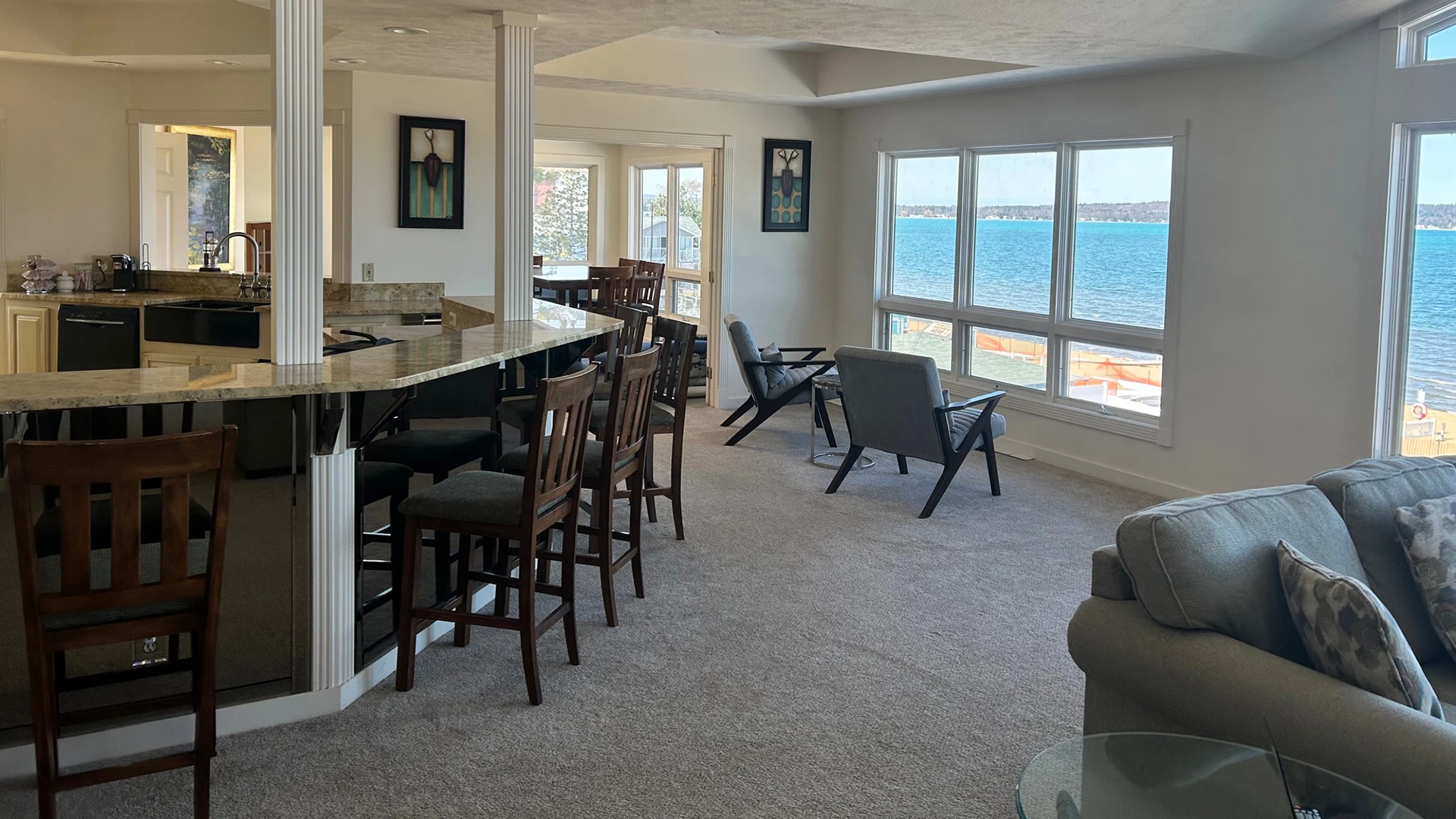 a room with a bar and chairs