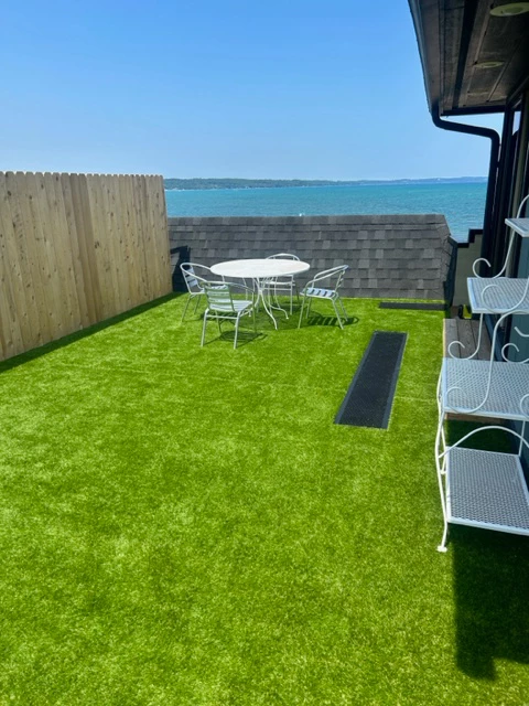 a patio with a table and chairs