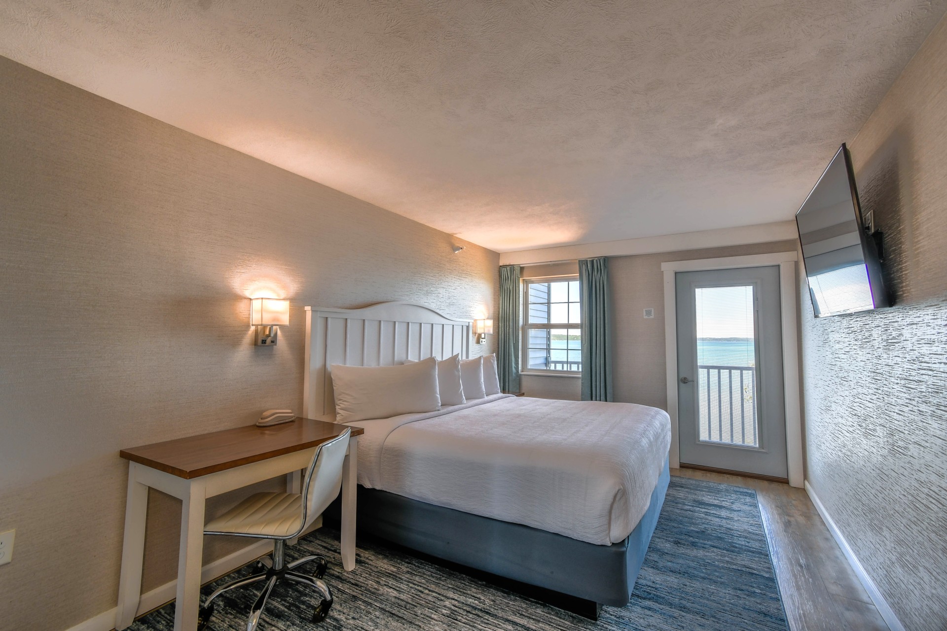 a room with a bed and a desk