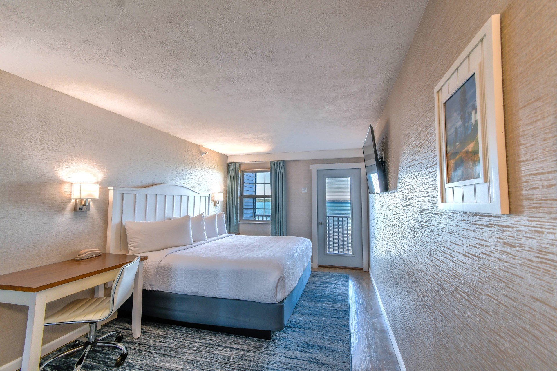a room with a bed and desk