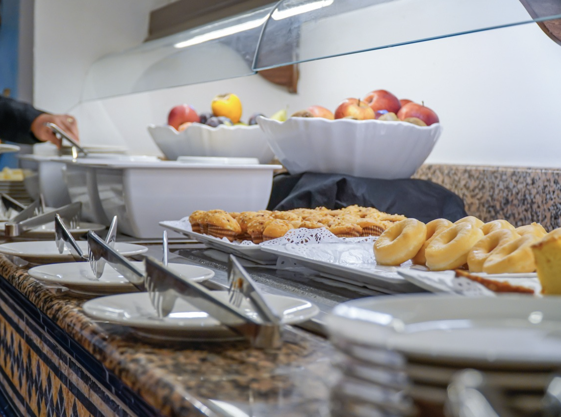 a buffet table with plates and food
