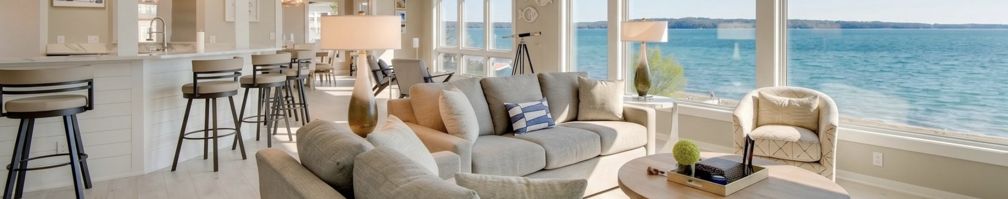 a couch in a room with a view of the ocean