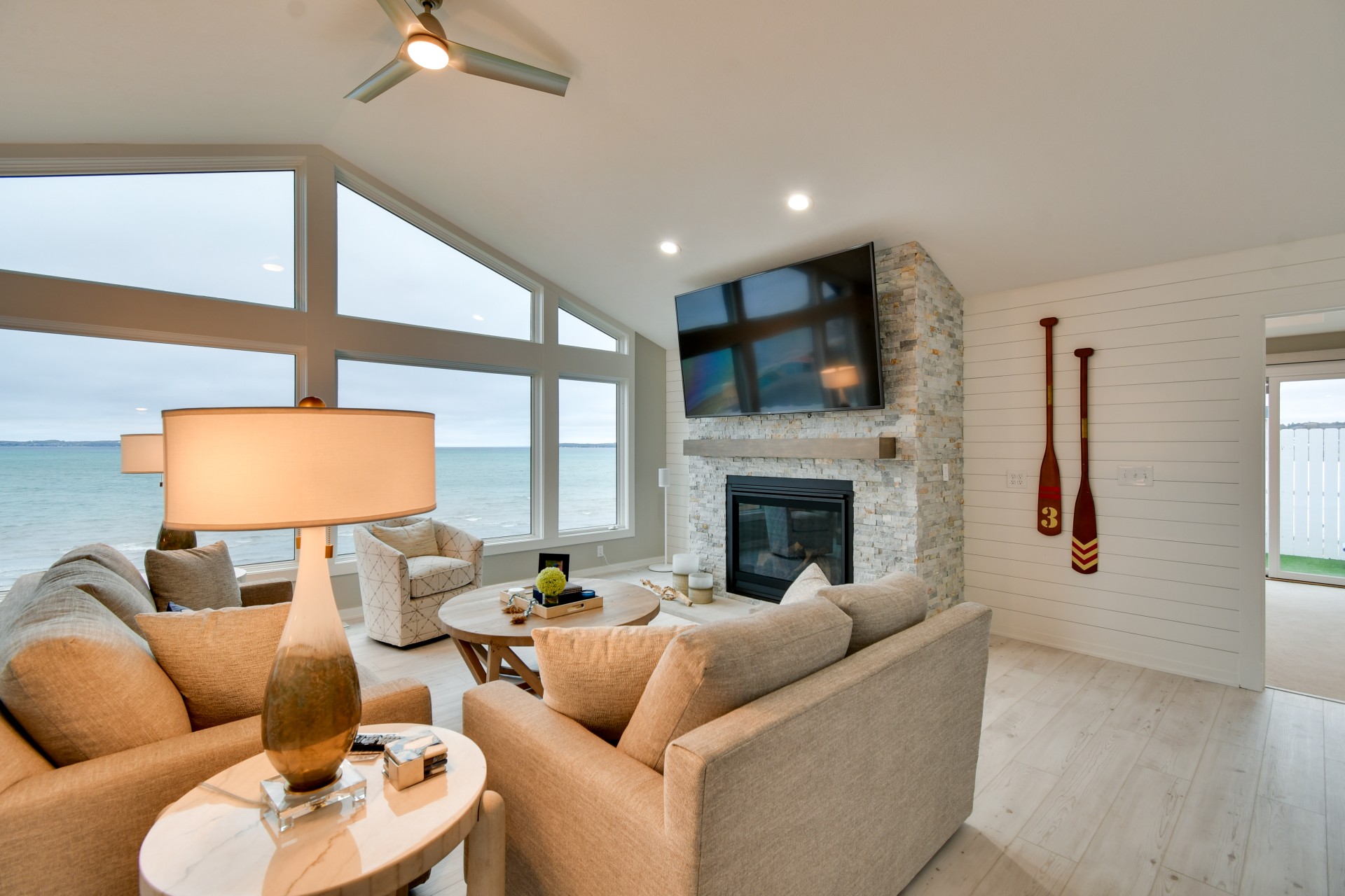 a living room with a fireplace and a television