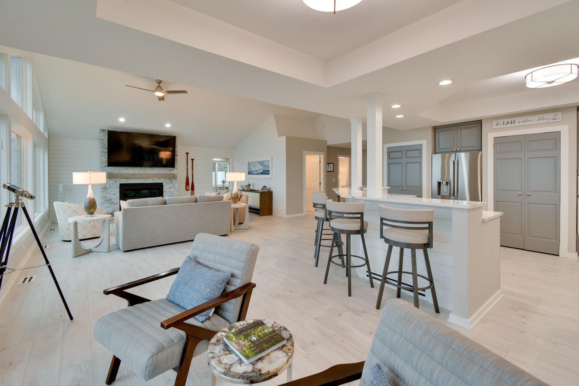 a living room with a kitchen and a bar