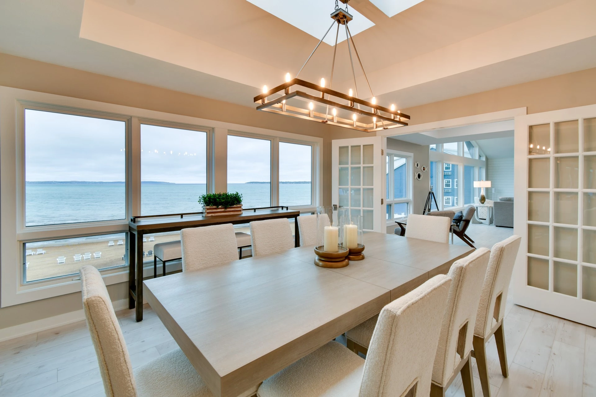a dining room with a large table and chairs